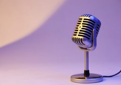 retro microphone isolated on color background
